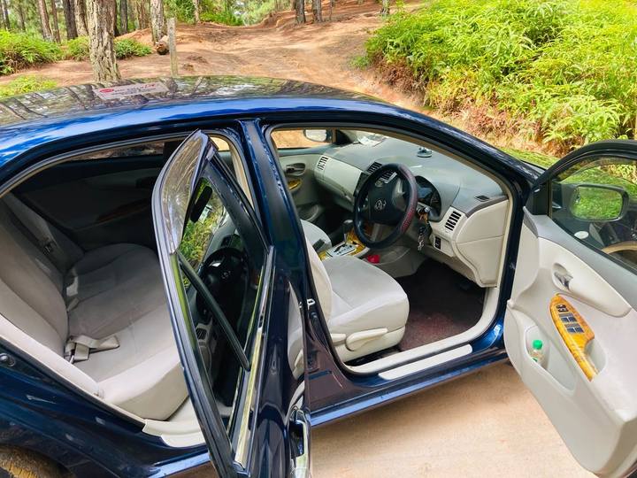 Clean beige interior of a private air-conditioned transfer car in Sri Lanka